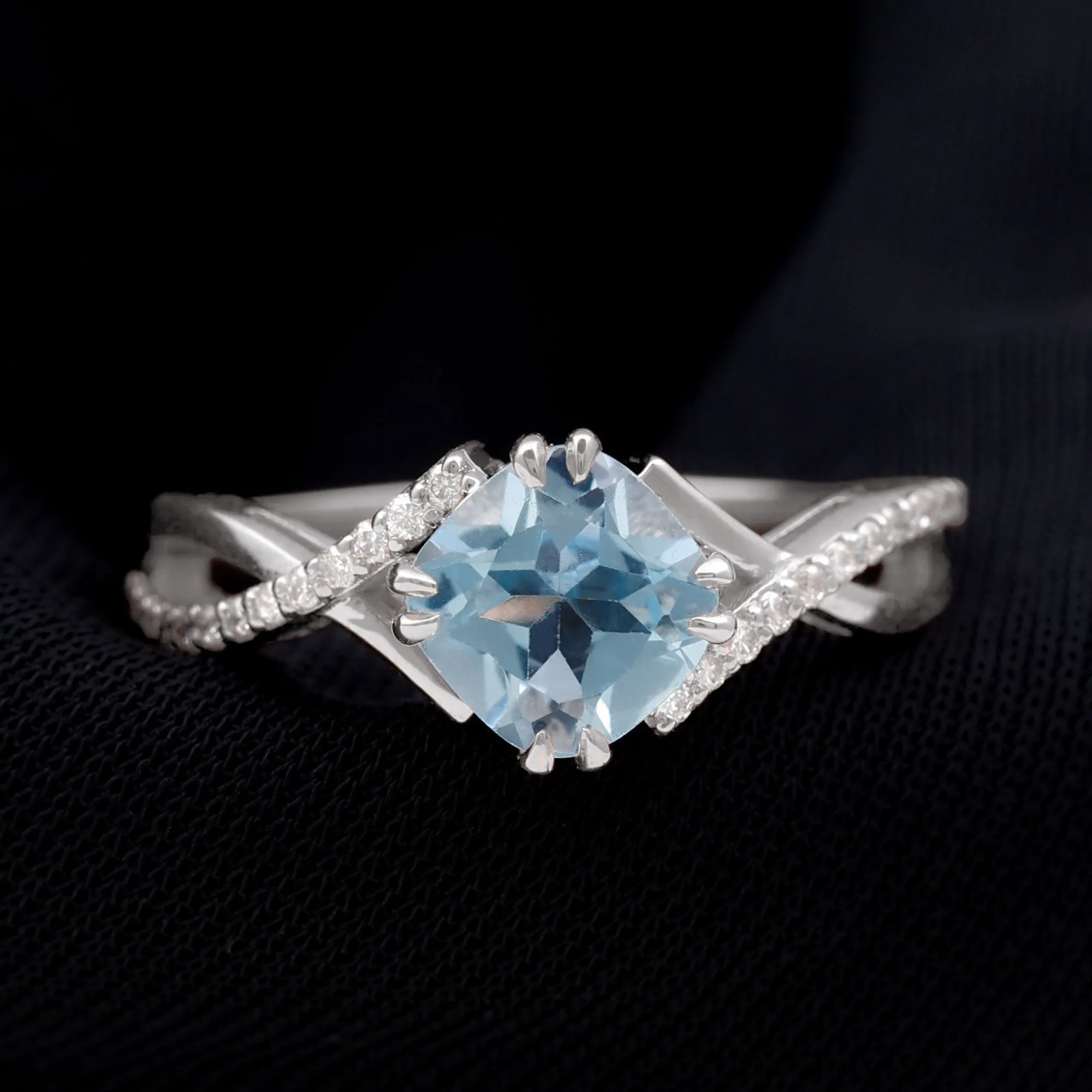 Cushion Cut Sky Blue Topaz Crossover Engagement Ring with Diamond