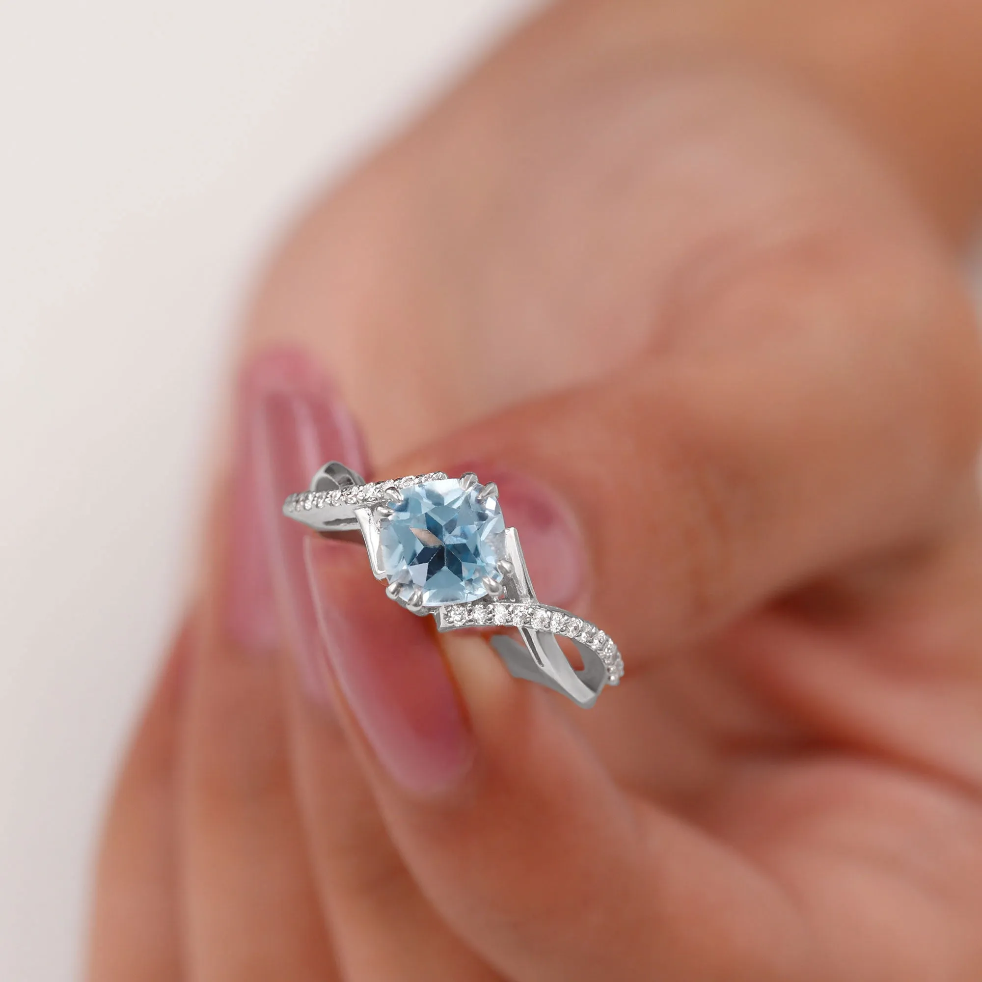 Cushion Cut Sky Blue Topaz Crossover Engagement Ring with Diamond